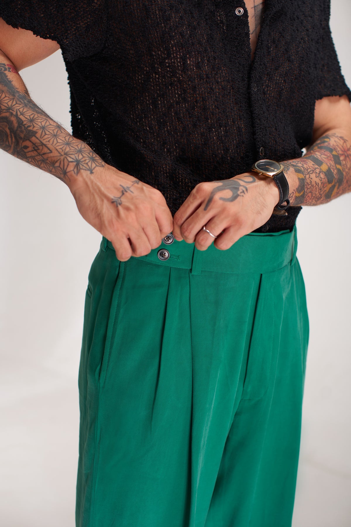 men black shirt green pent