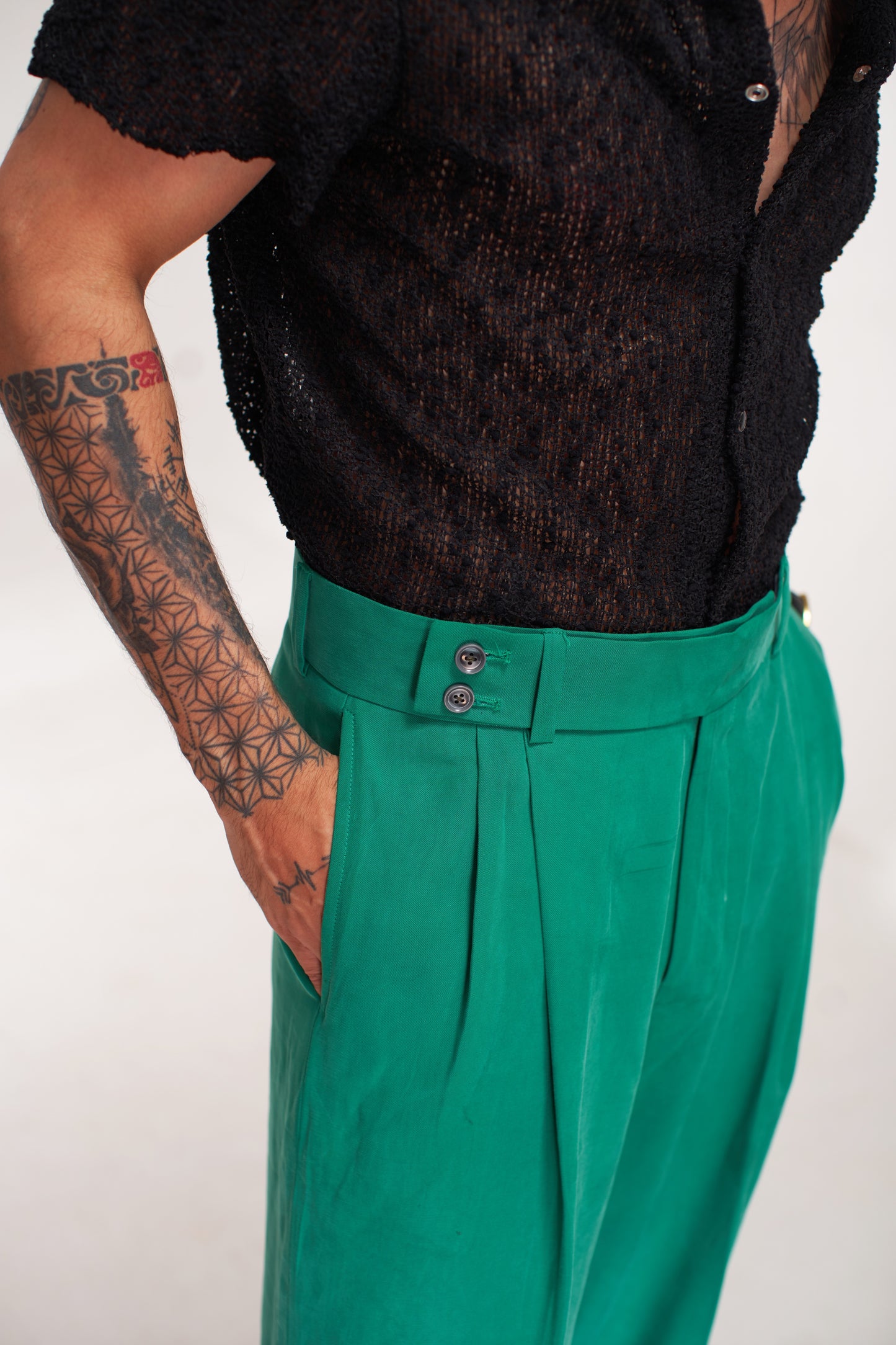 men black shirt green pent