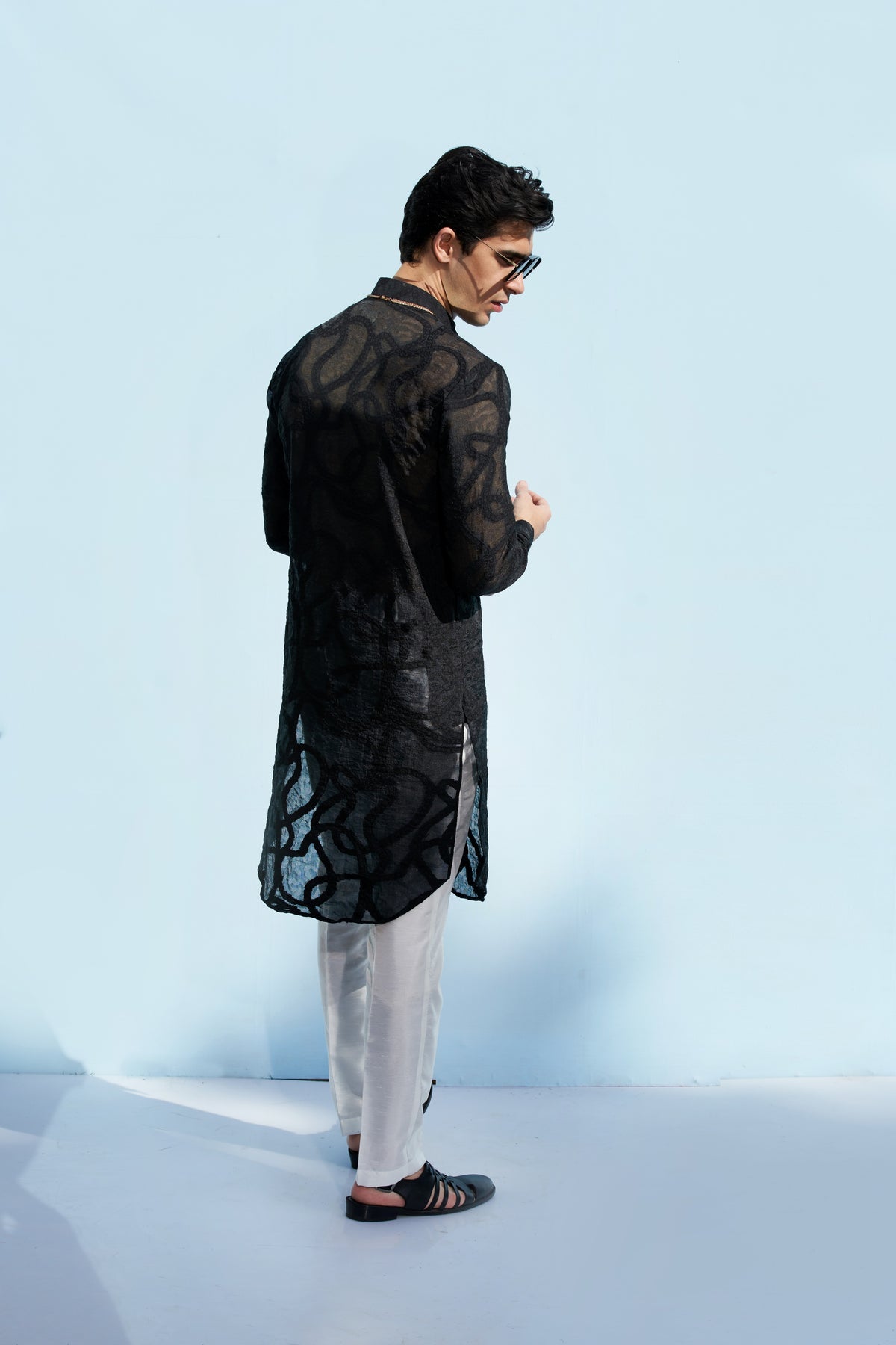 Men black kurta and white trousers
