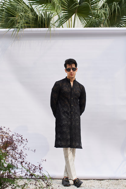 Men black kurta and white trousers